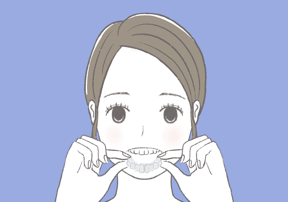 マウスピースをはめる女性